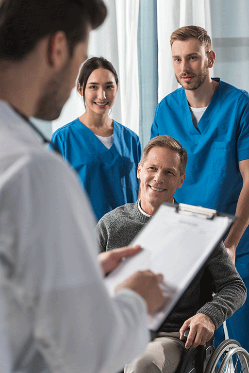 smiling mature patient on wheelchair listening doc 2024 11 18 06 36 32 utc